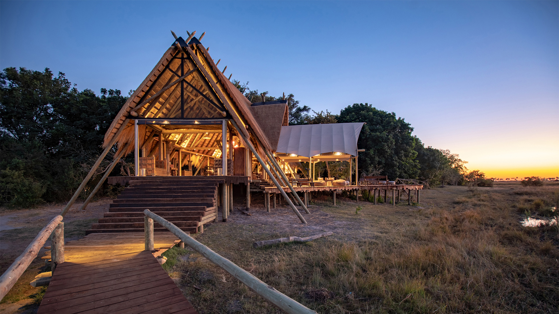 Main thatched lodge at sunset at Selinda Camp