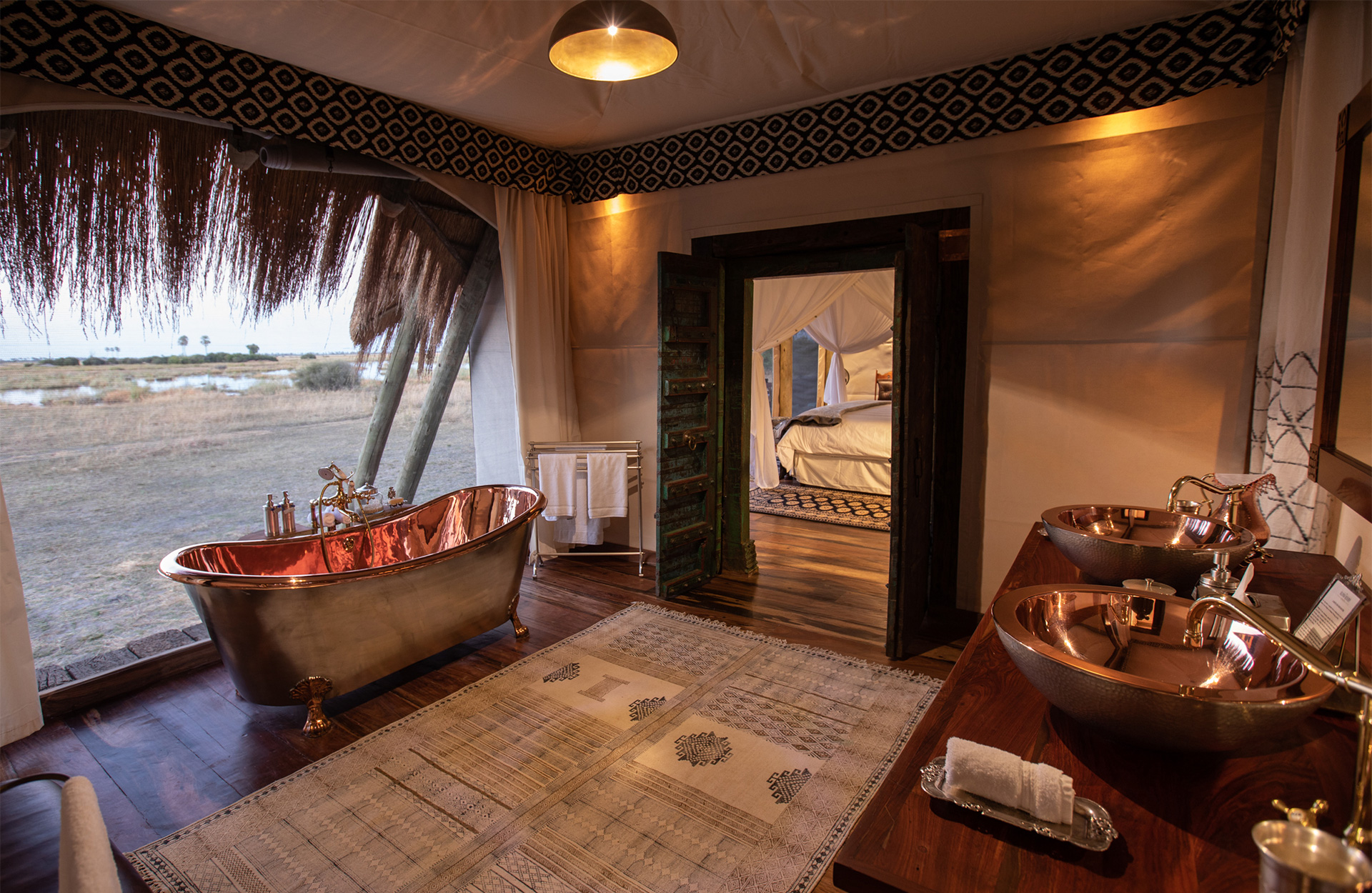 Copper bathtub with floodplain views at Selinda Camp