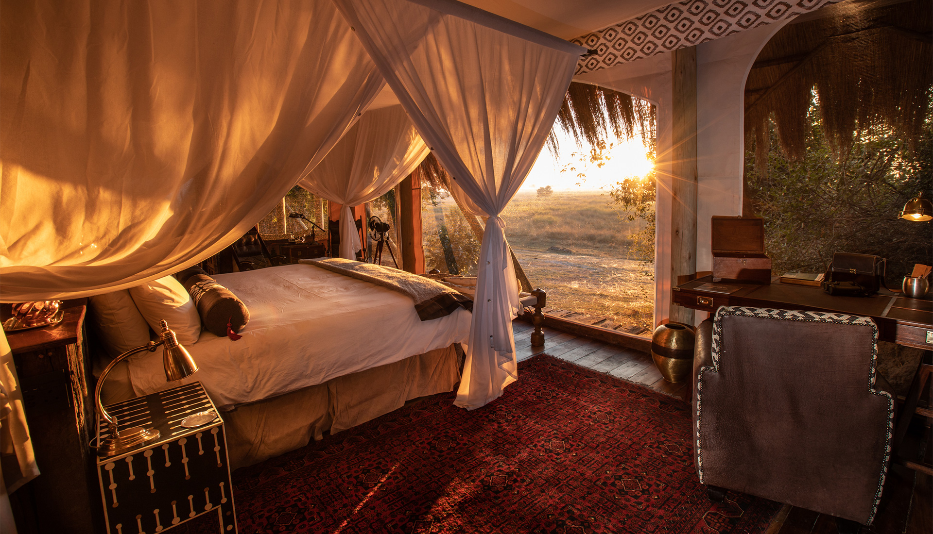 Guest bedroom at sunset at Selinda Camp